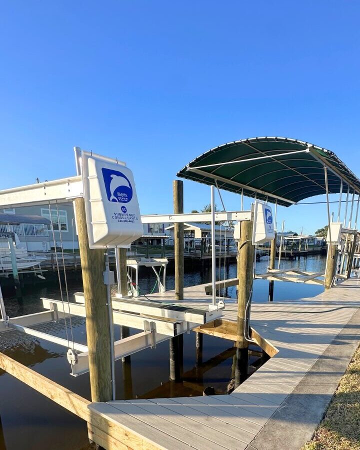 St james city dock with 2 dolphin boatlifts